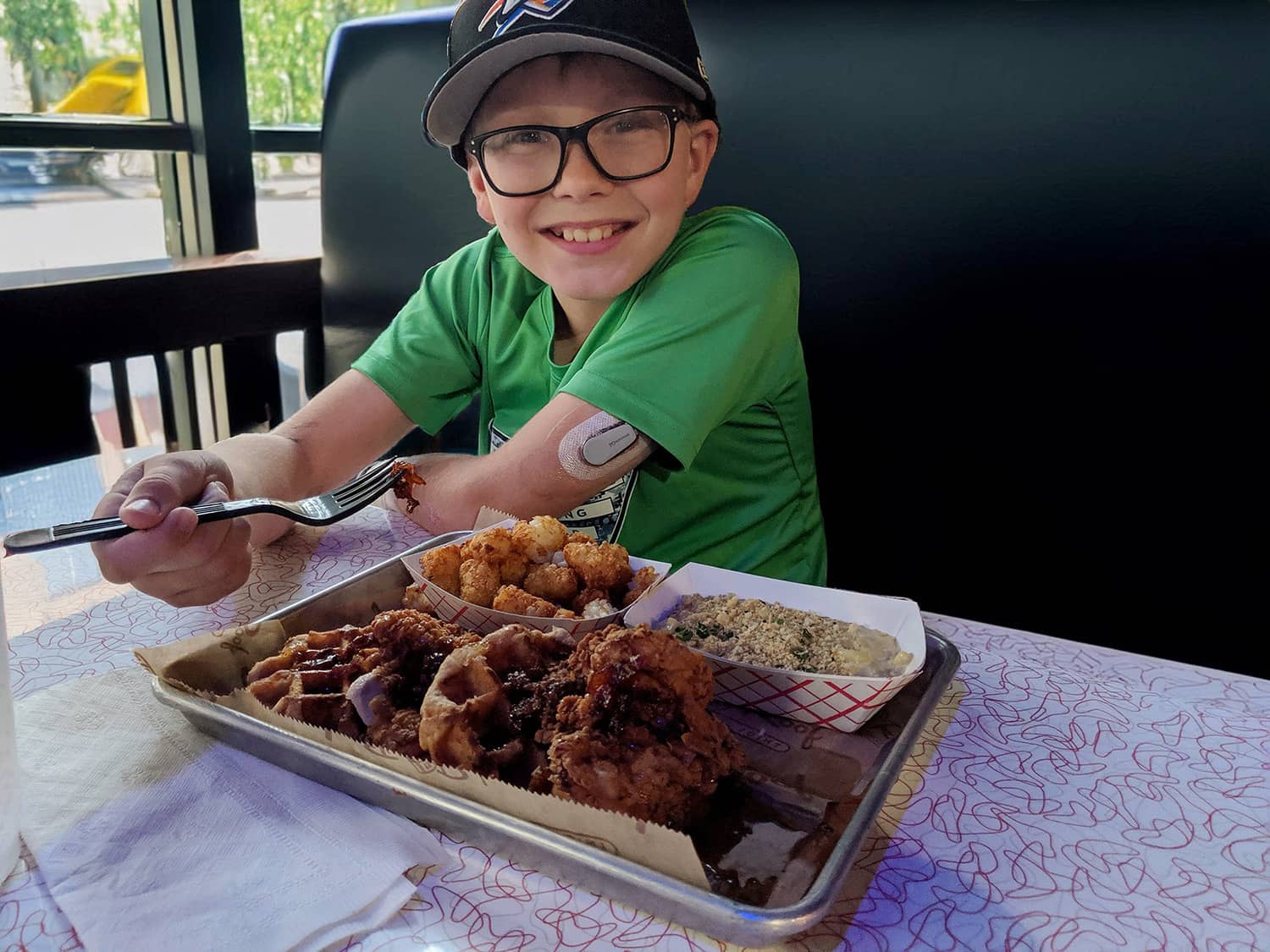 Child enjoying a meal at a T1D community gathering